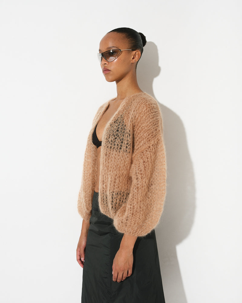 Model wearing light mohair bomber cardigan with spring stripes by Maiami, Spring 2025
