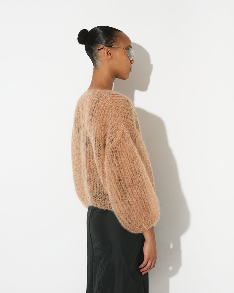 Model wearing light mohair bomber cardigan with spring stripes by Maiami, Spring 2025