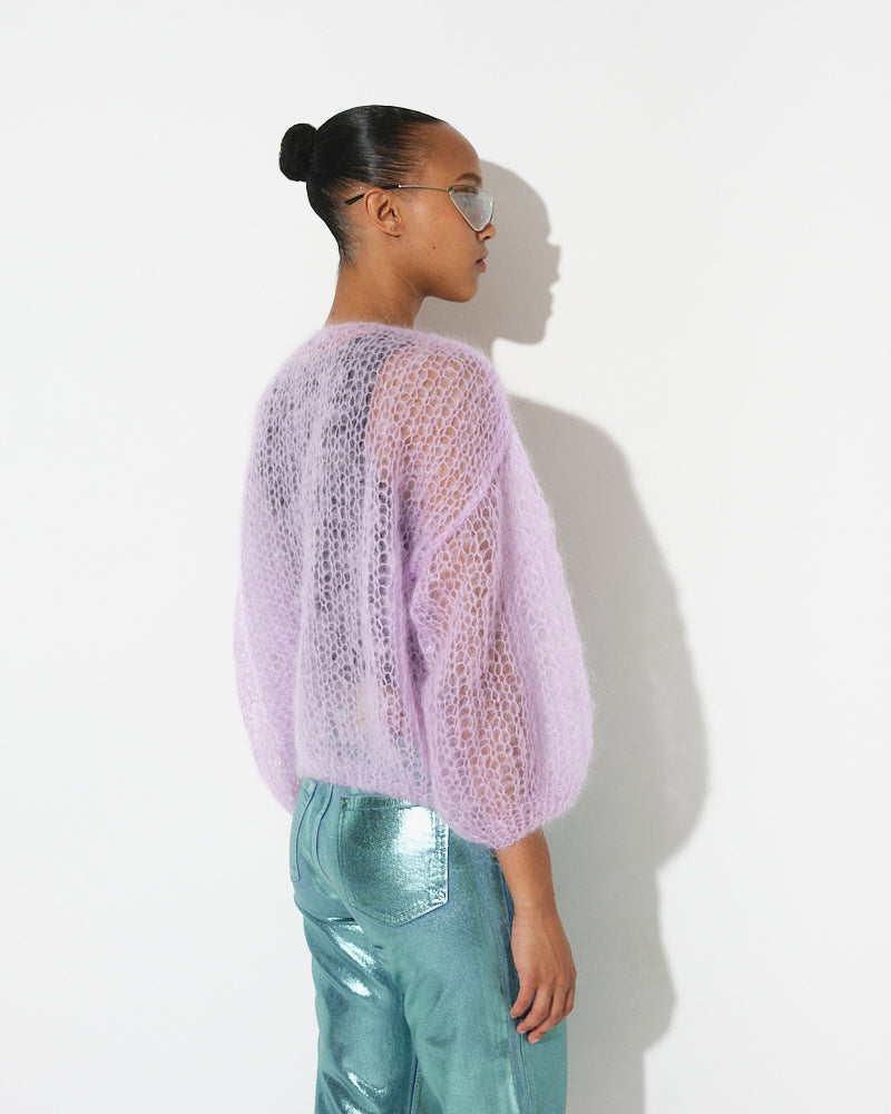 Model wearing light mohair bomber cardigan with spring stripes by Maiami, Spring 2025