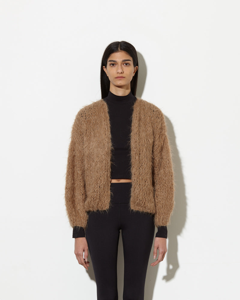 Model wearing Alpaca cardigan in beige brown.
