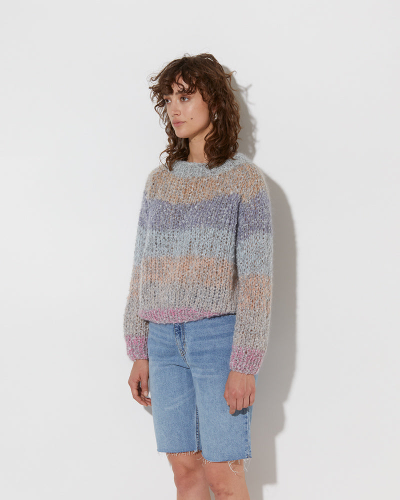 model wearing the spring boucle rainbow mohair sweater in haze. Shot from the side