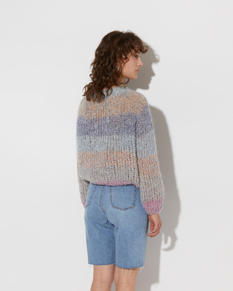 model wearing the spring boucle rainbow mohair sweater in haze. Shot from the back