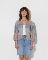 model wearing the spring boucle bomber cardigan in haze. Shot from the front