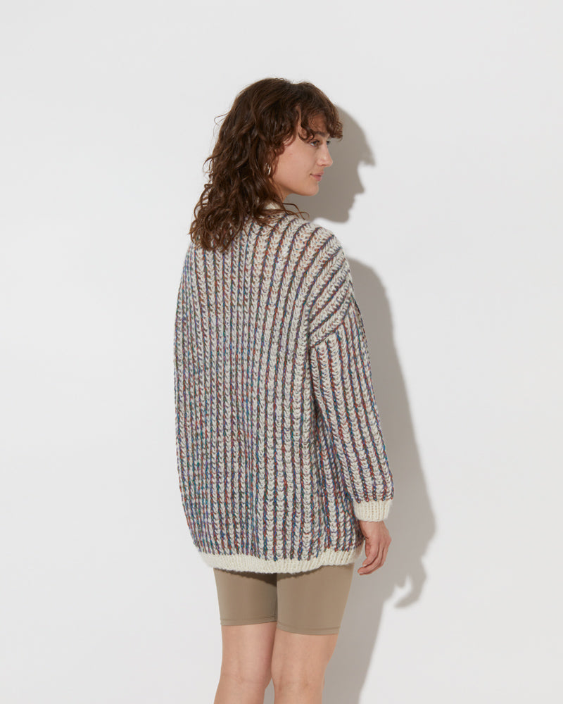  model wearing the spring cashmere brioche cardigan in creme and multicolour. Shot from the back