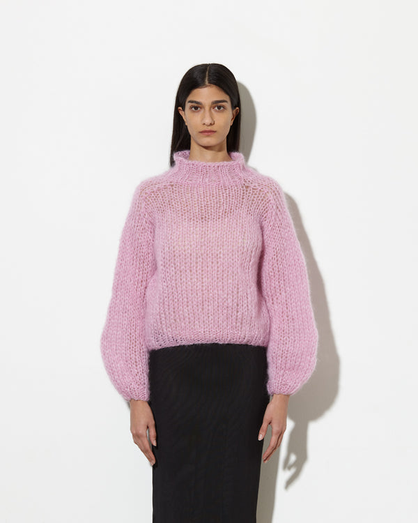 model wearing Mohair turtleneck in rose. hand-knitted with love.