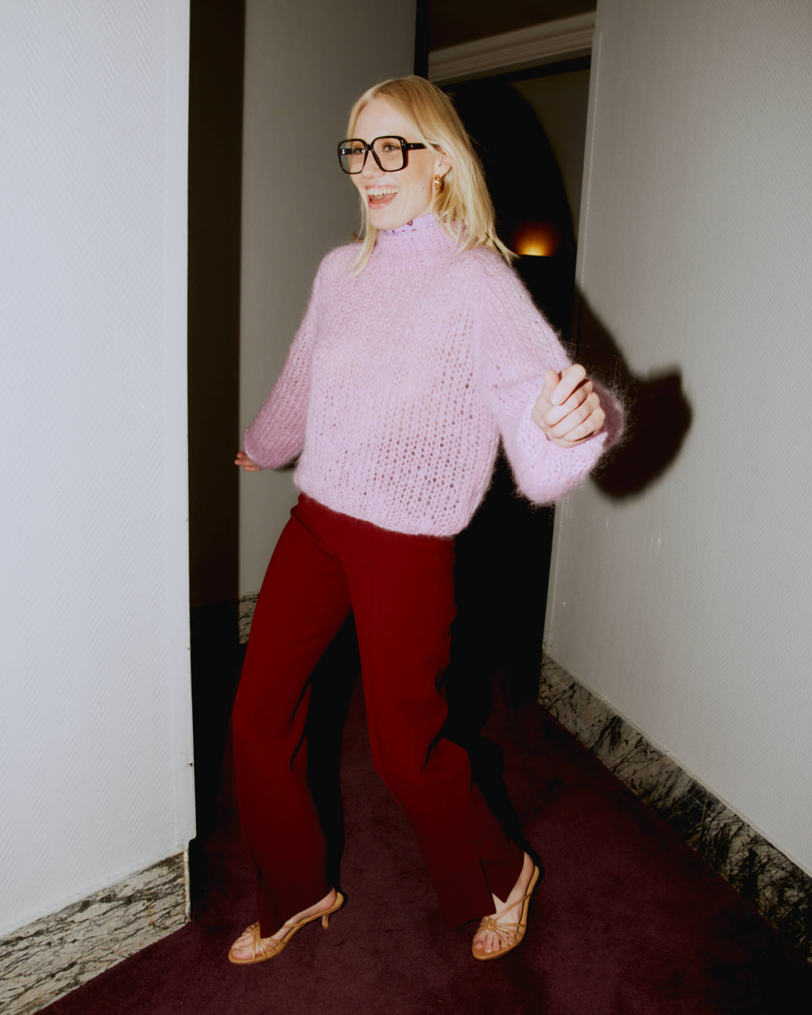 model happily wearing Mohair turtleneck in rose. hand-knitted with love.