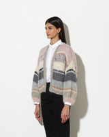 Model from the side wearing Mohair cardigan womens in the colour muted pastels.