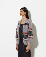 Model from the side wearing Mohair cardigan womens in the colour muted.