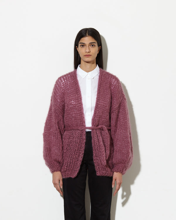 Model wearing Long cardigan in the colour mauve.