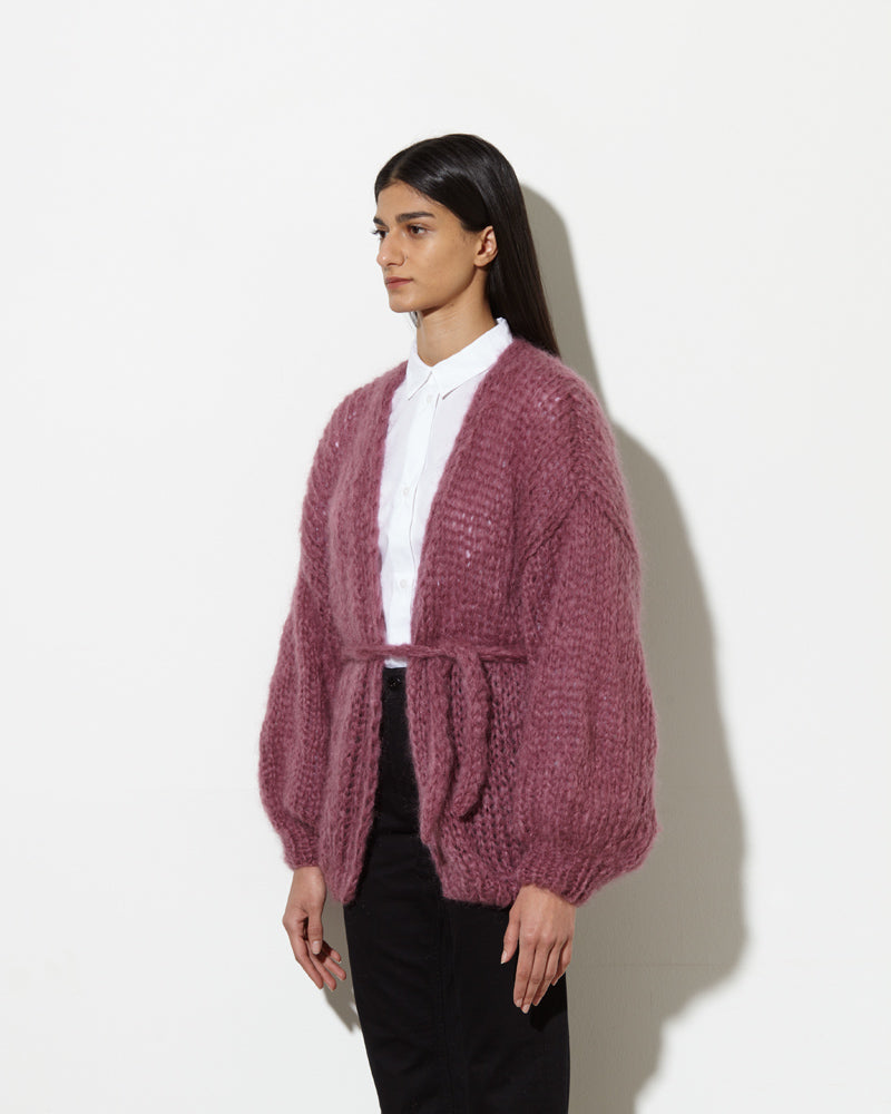Model from the side wearing Long cardigan in the colour mauve.