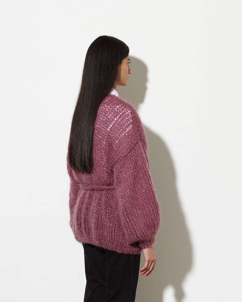Model from the back wearing Long cardigan in the colour mauve.