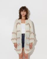 model wearing the wavy spring oversized cotton cardigan in creme and summer tan. Shot from the front