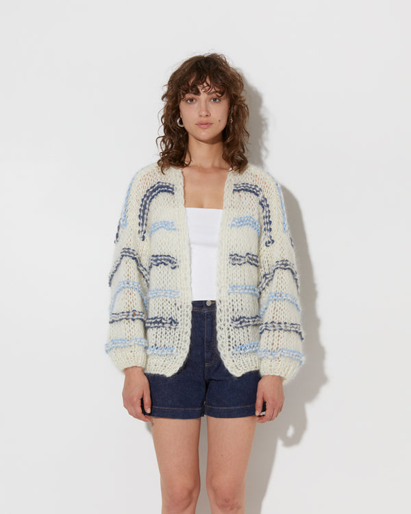 model wearing the wavy spring mohair bomber cardigan in creme-blue. Shot from the front